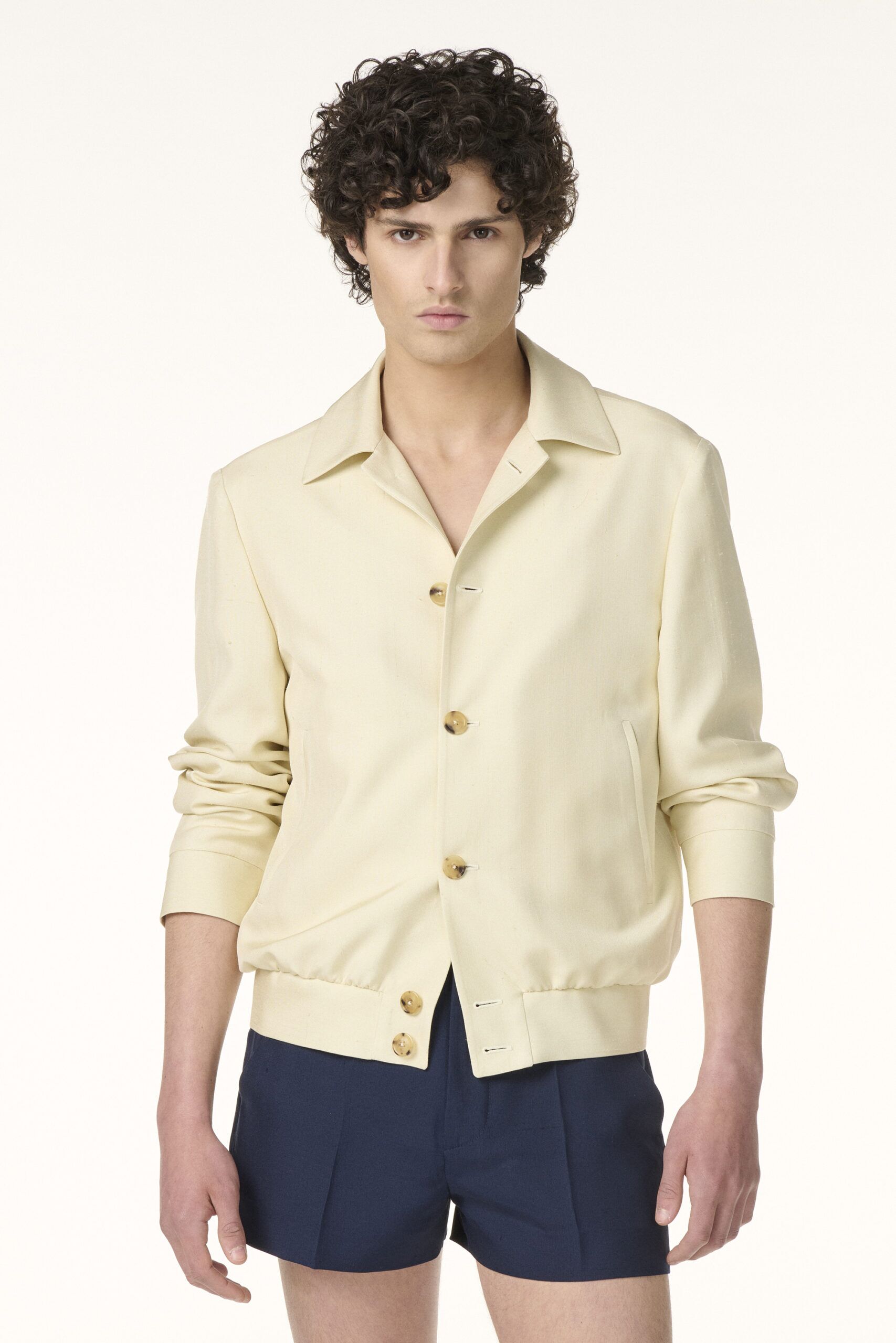 RIVES Paris tailor-made jacket in cream fabric with wooden buttons.
